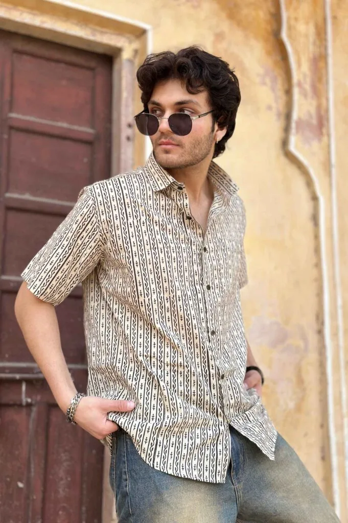 Men in Black Vertical Striped Half Sleeve White Shirt with jeans