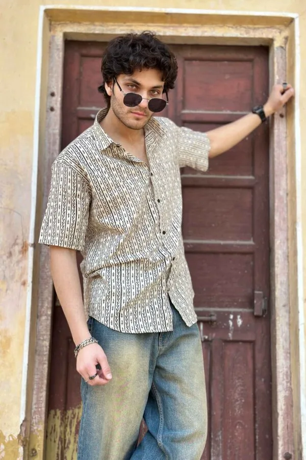 Men in Black Vertical Striped Half Sleeve White Shirt with jeans