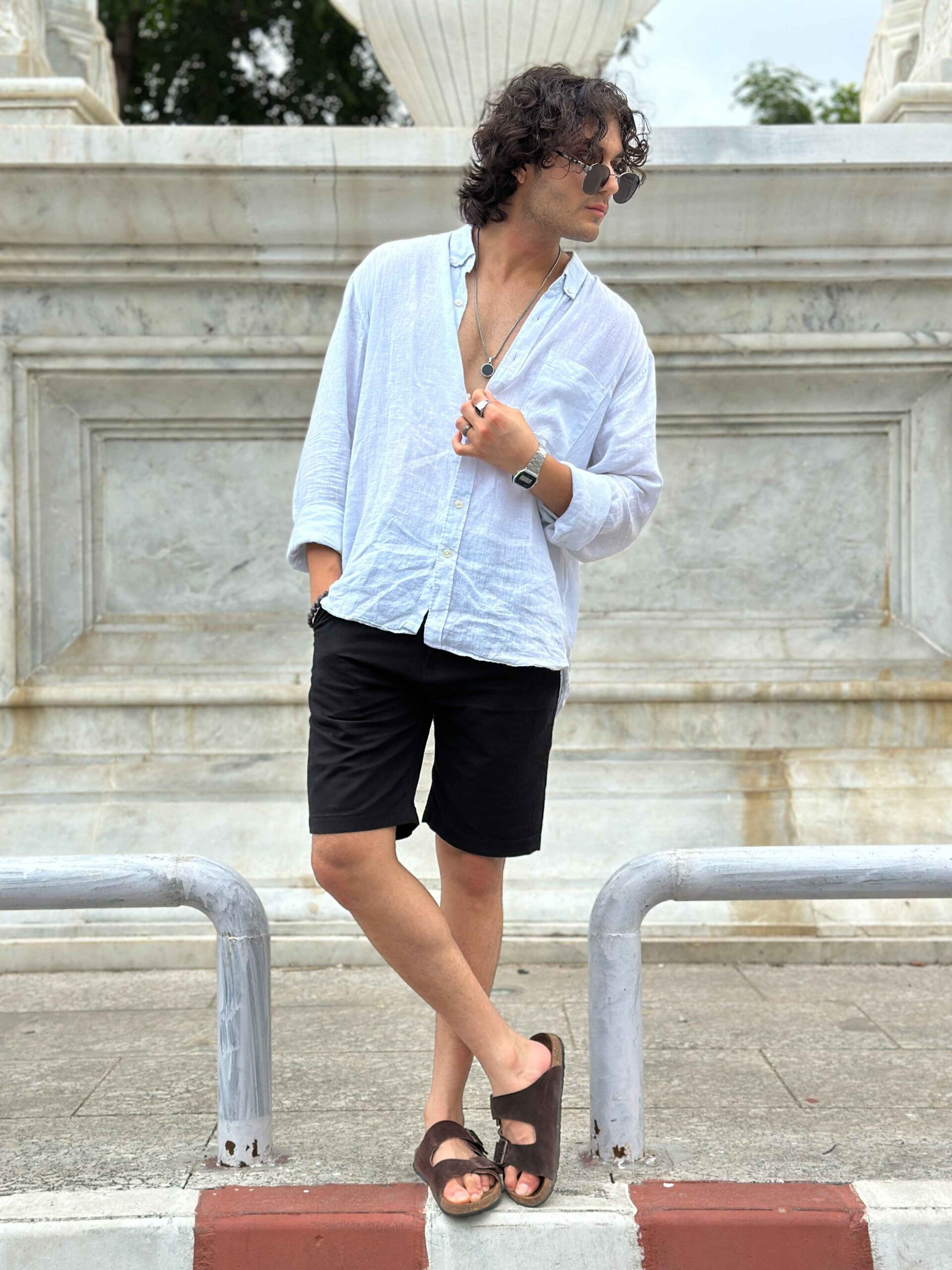 Full-length view of men's black linen shorts, highlighting the comfortable design and casual look